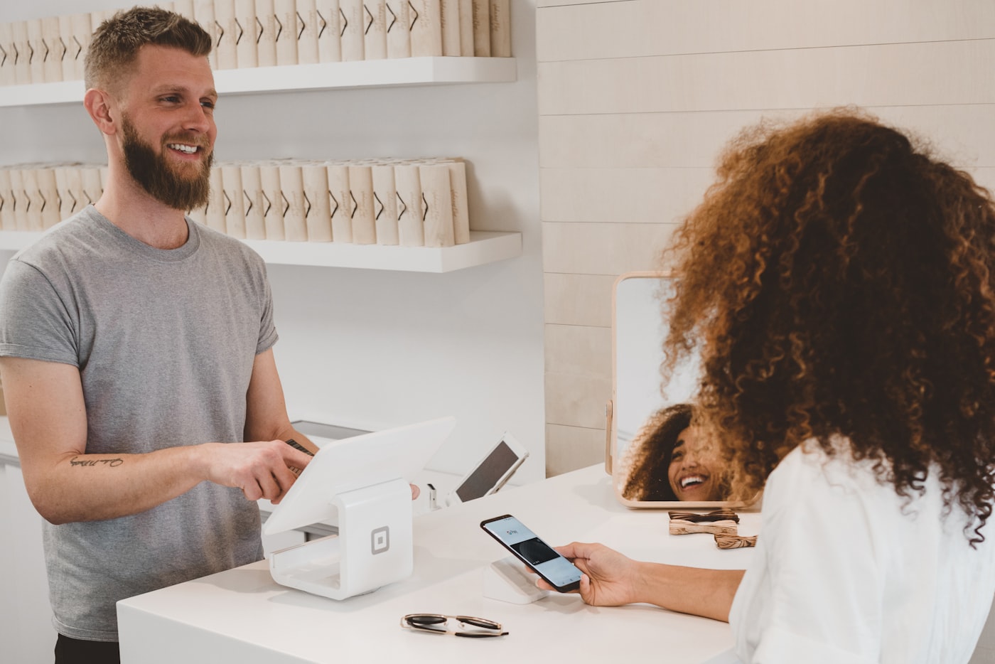 Local business owner serving a happy customer